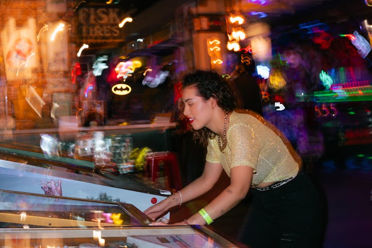 Woman Playing Game In Bar