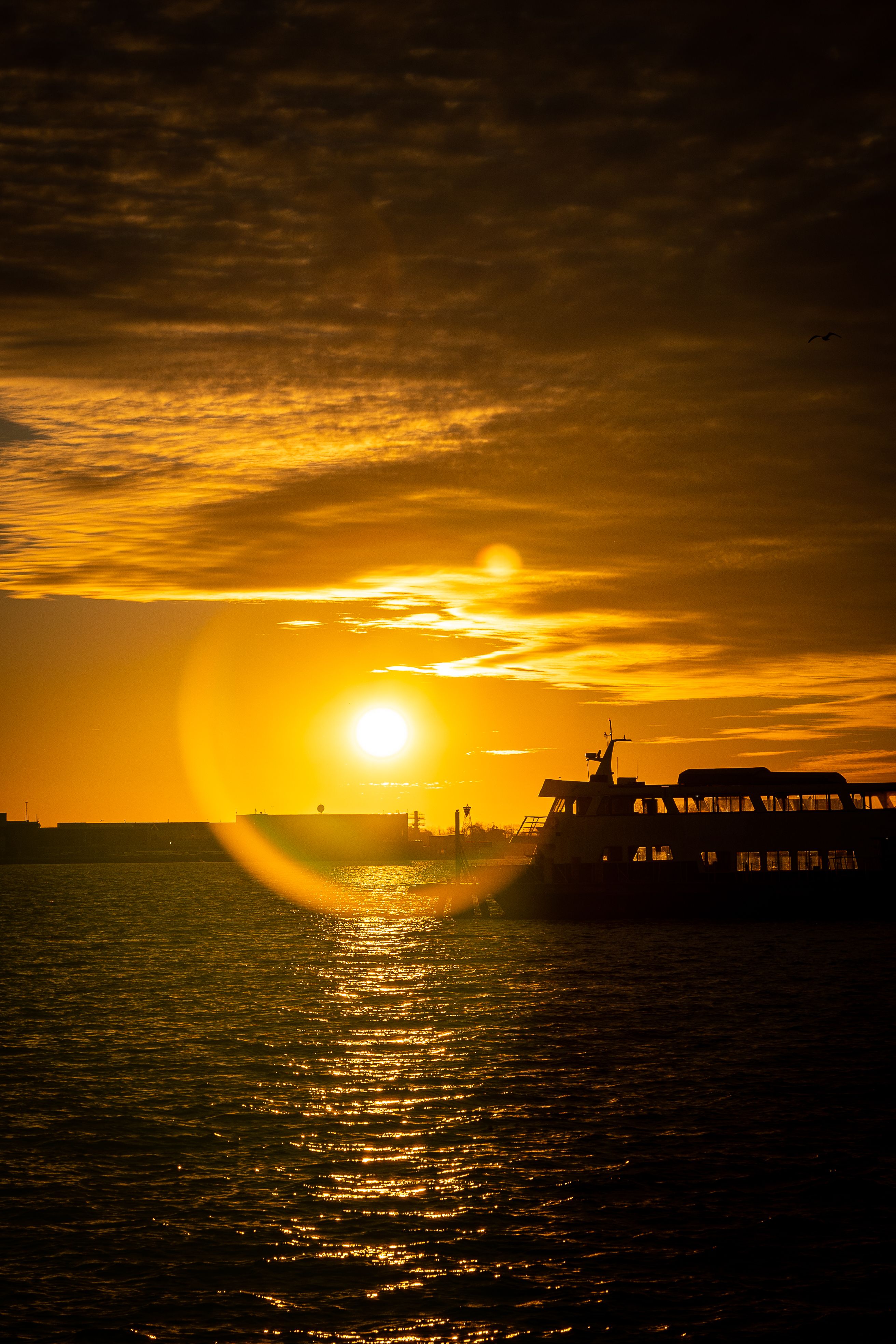 Silhouetted Ships on the Sea at Sunset · Free Stock Photo