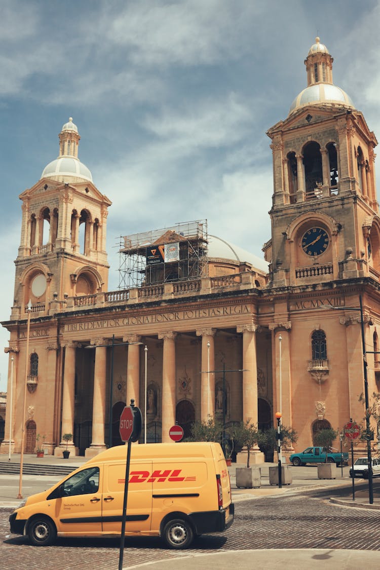 Facade Of A Neoclassical Building And A Delivery Van