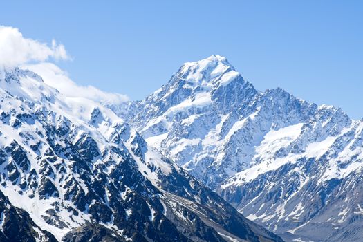 A breathtaking view of the snow-covered peaks of Mount Cook, New Zealand's highest mountain.