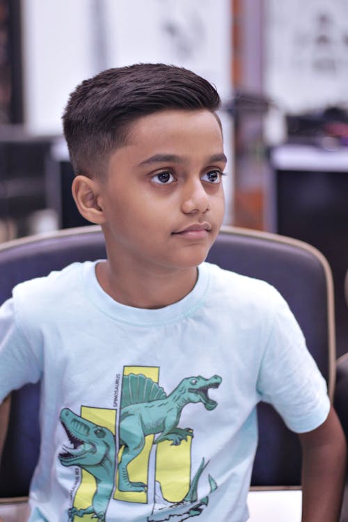 Sitting Boy in White T-shirt