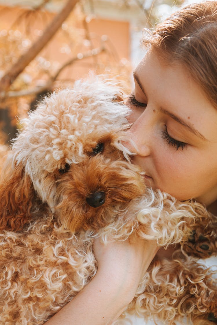 Woman Hugging Dog