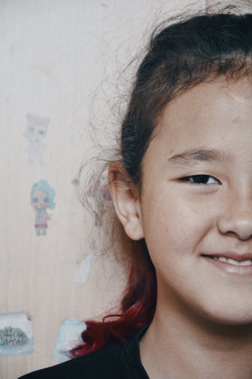 Free Close-up portrait of a smiling girl with black hair in Talgar, Kazakhstan. Stock Photo