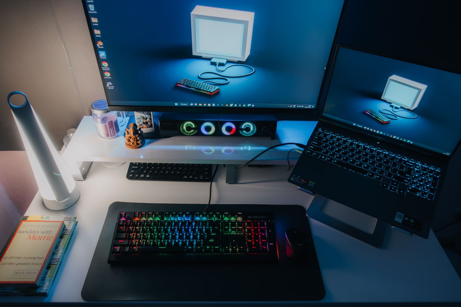 Organized computer desk with monitor, keyboard, mouse and connected technology