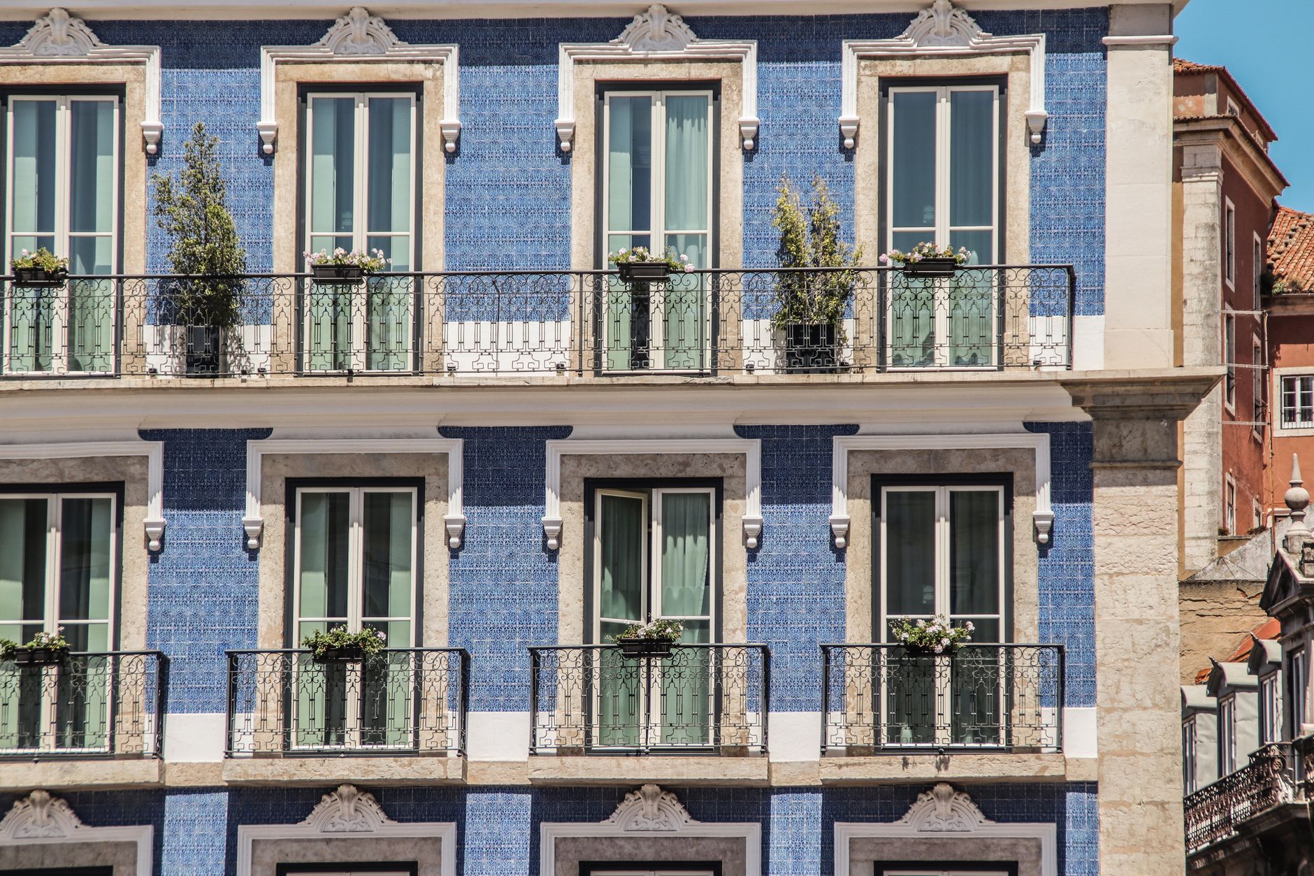Americans trying to buy property abroad get residency in 2026 — Lisbon building with blue tile facade and balconies