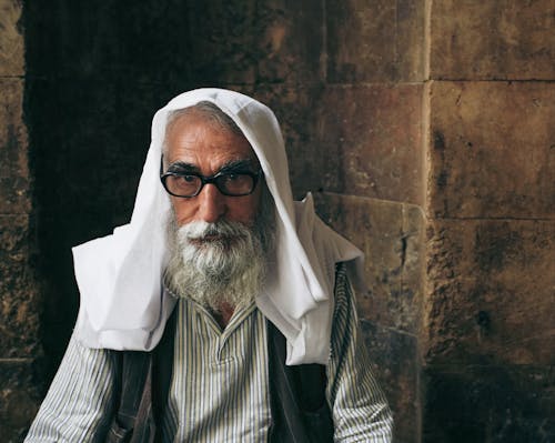 An Elderly Man with Headscarf