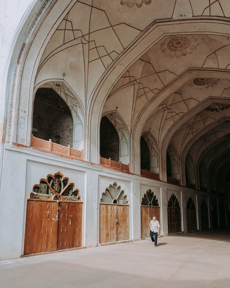 Man Walking Inside The Chhatta Chowk Bazaar At The Red Fort Of Delhi, India