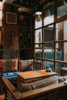 Warm and inviting restaurant interior with rustic decor and wooden furnishings.