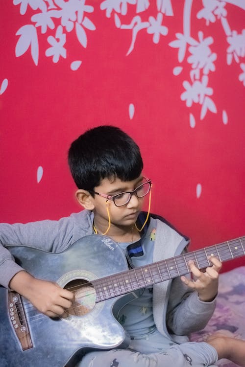 Free Boy Playing the Guitar  Stock Photo