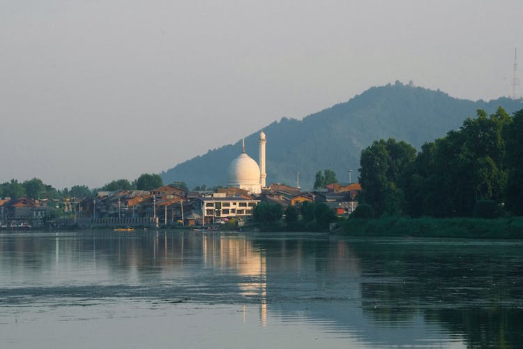 Temple In Village By River In India