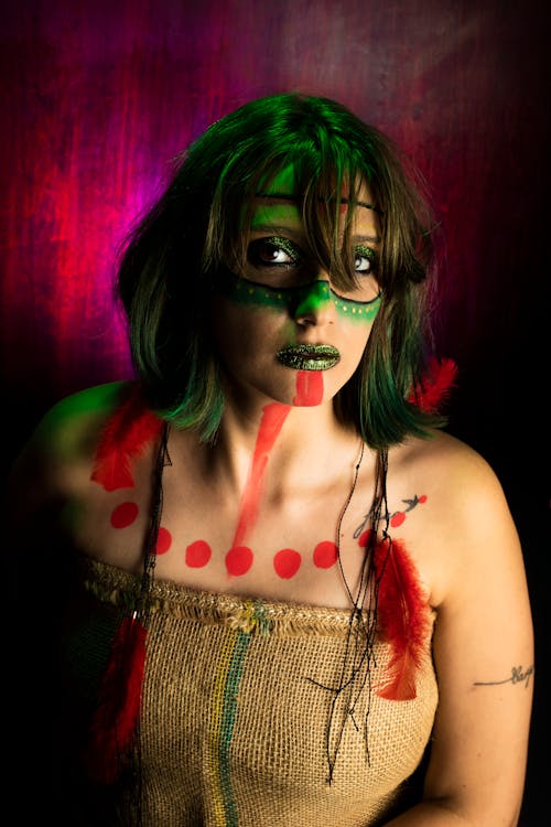 Studio Shot of a Young Woman with Body Painting and Wearing a Costume 