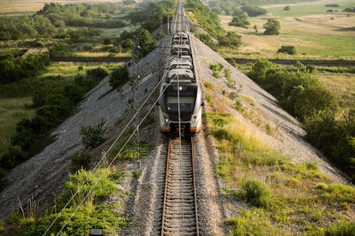 Aerial View of a Train on the Railway in the Countryside 