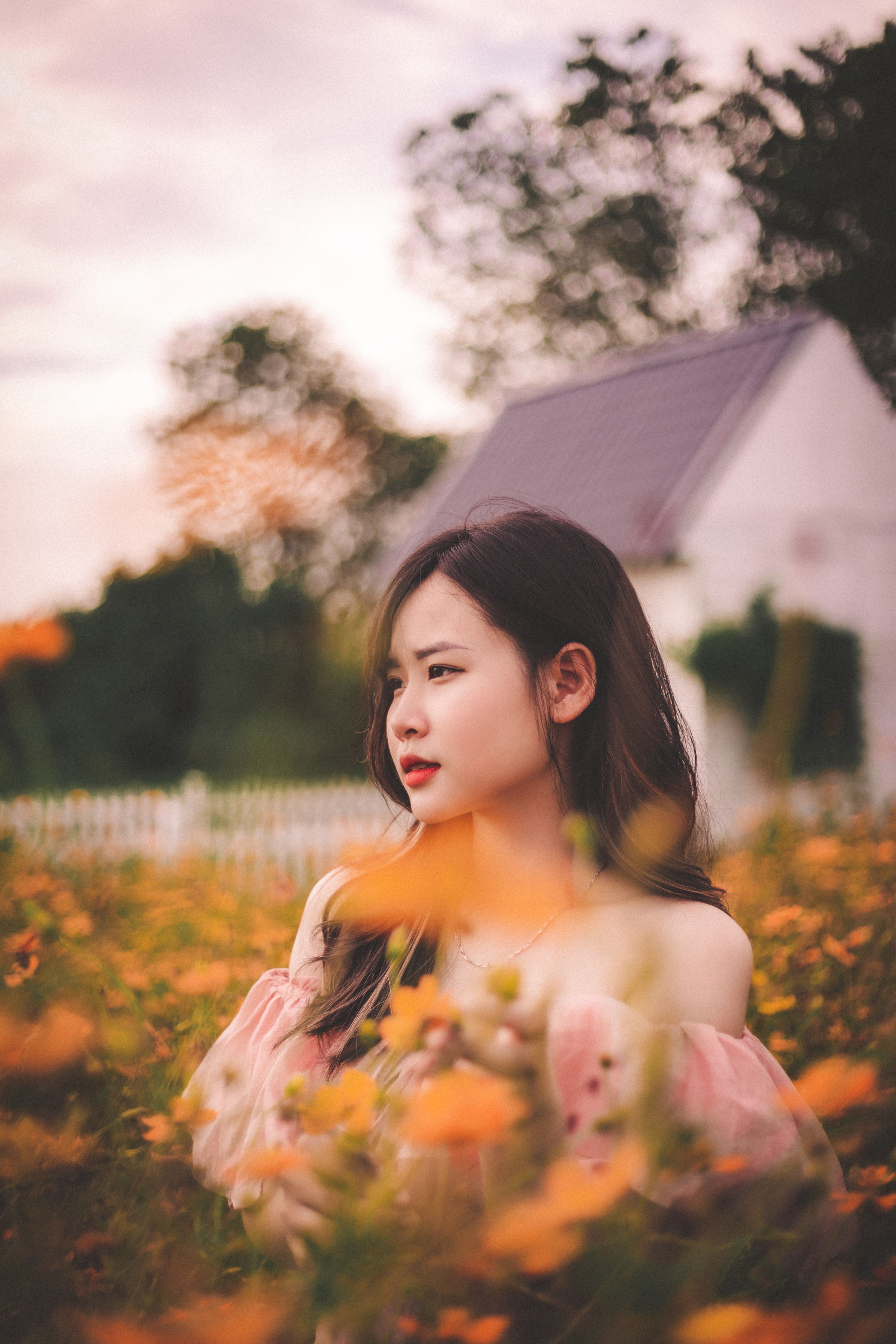 Young Woman Standing on a Flower Field · Free Stock Photo
