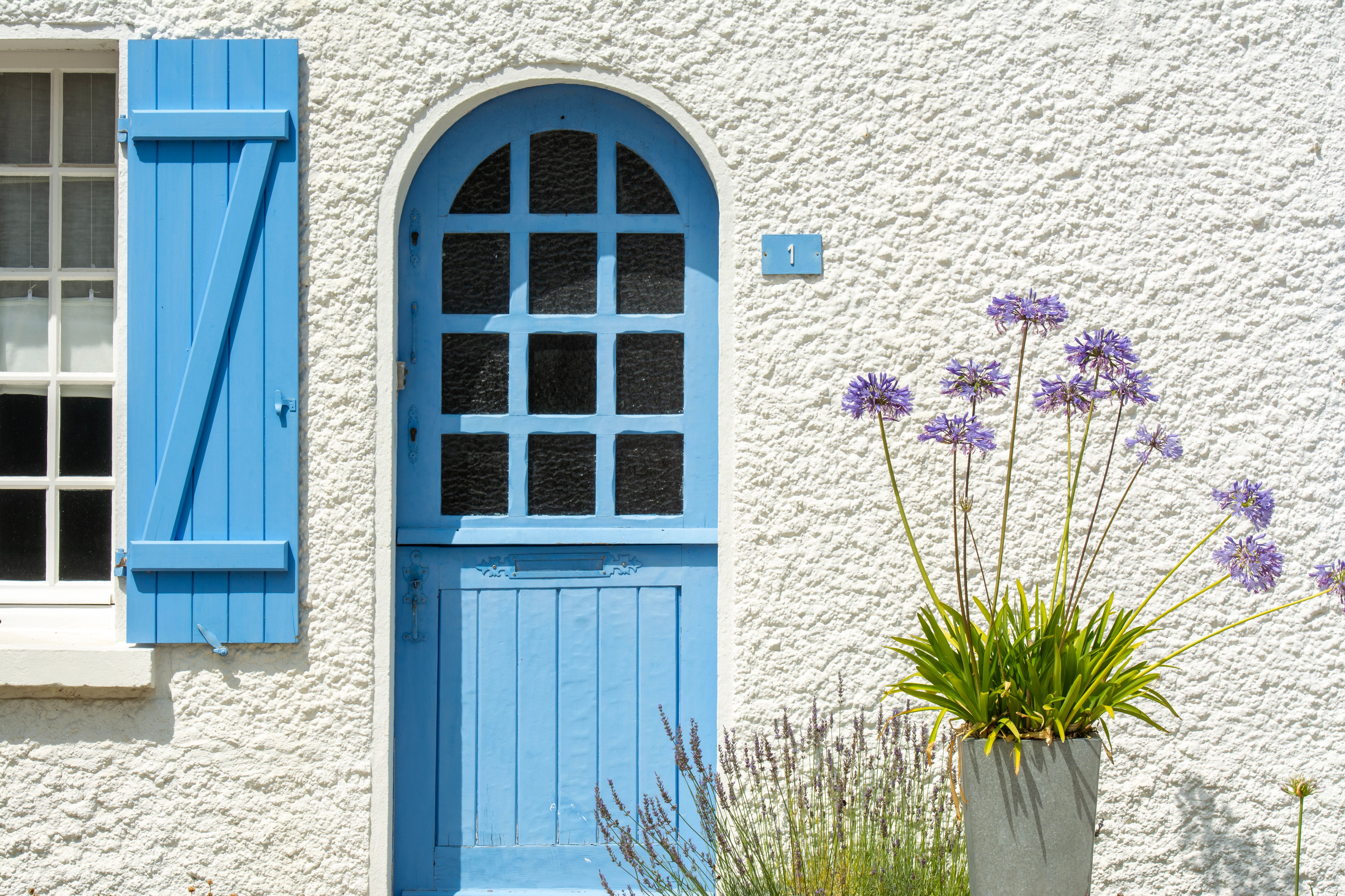Exterior of a House with Blue Door and Blue Window Shutters · Free ...