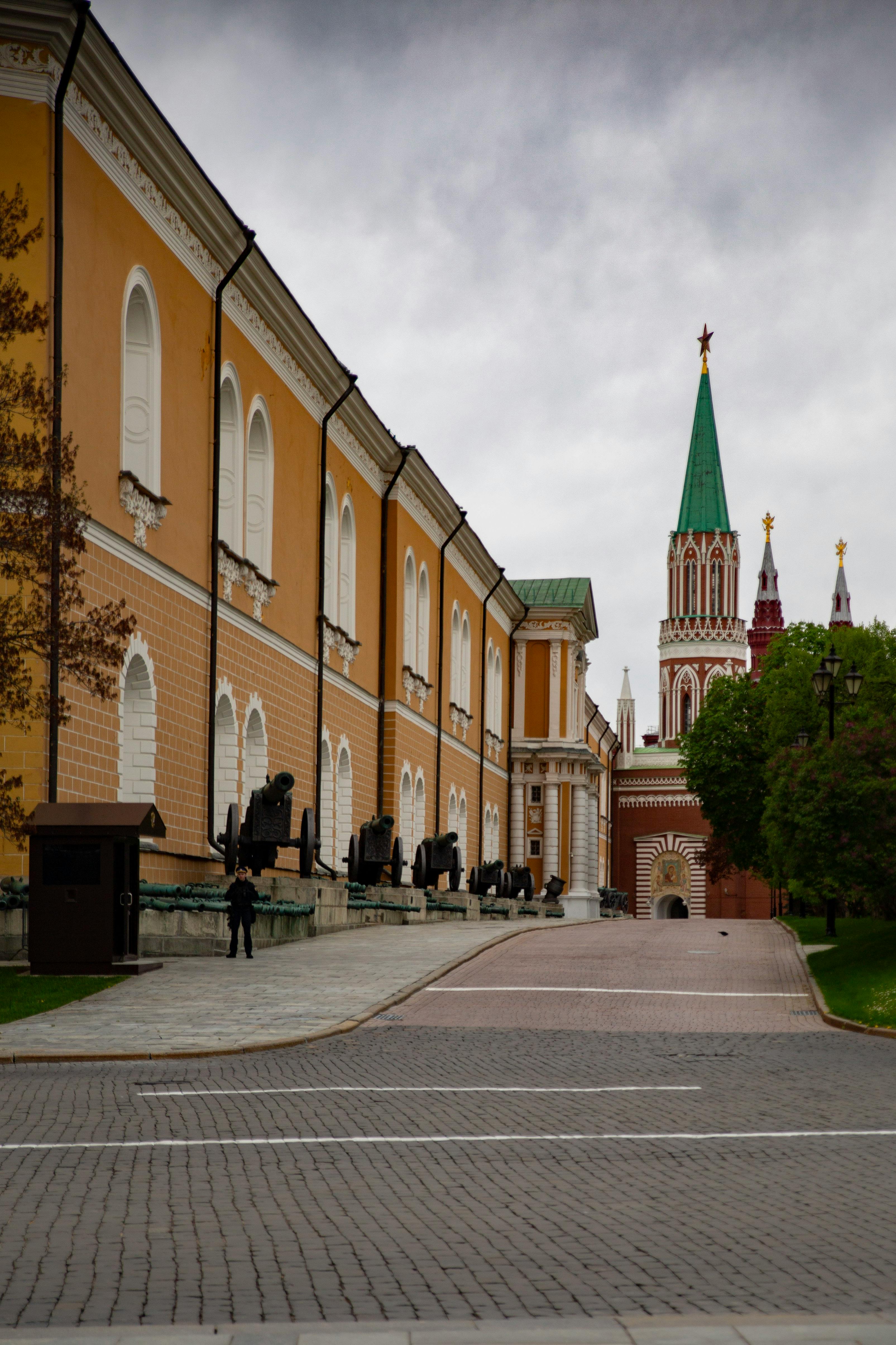 Historic Kremlin Arsenal building with iconic architecture and cobblestone path in view.