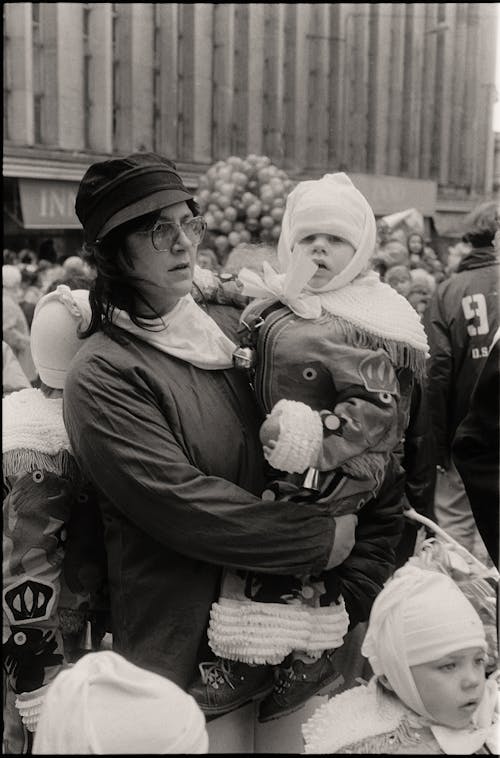 An Old Photograph of a Mother Holding Her Baby Dressed in a Costume 