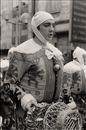 Man in a Costume at a Festive Procession
