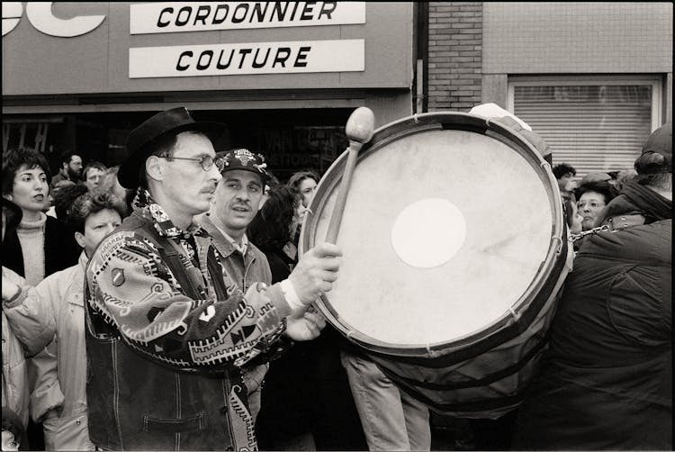 Man Playing On Drum In Black And White