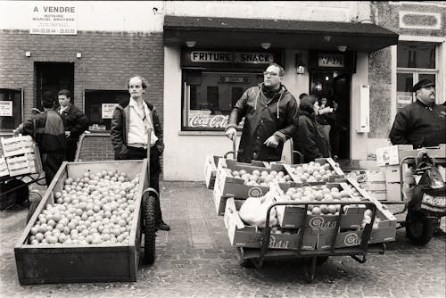 People Selling Fruits on Market in Black and White