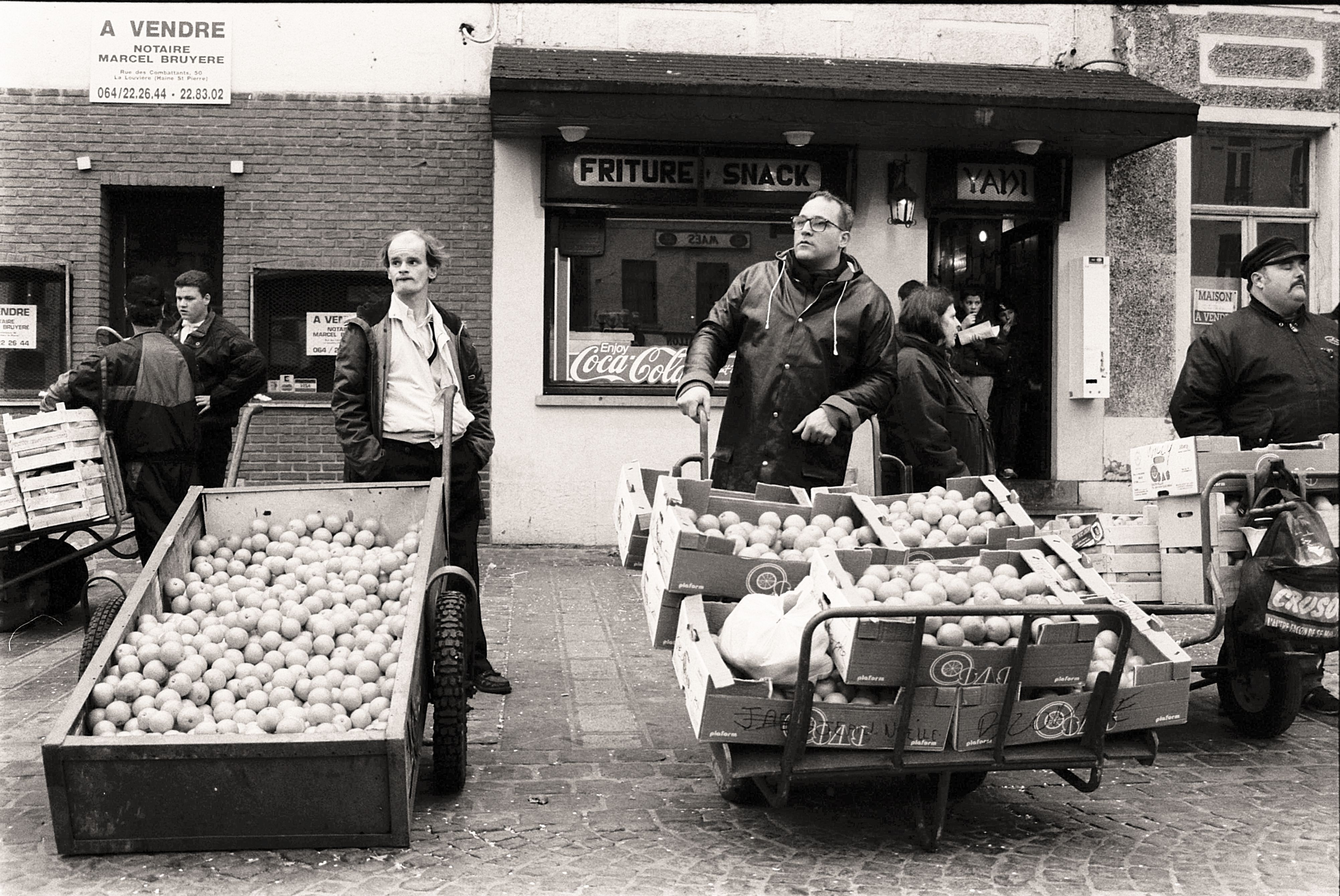 People Selling Fruits on Market in Black and White · Free Stock Photo