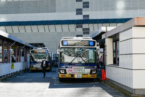 Free Urban scene featuring Keio buses at a bus station in Japan, showcasing public transportation and city life. Stock Photo