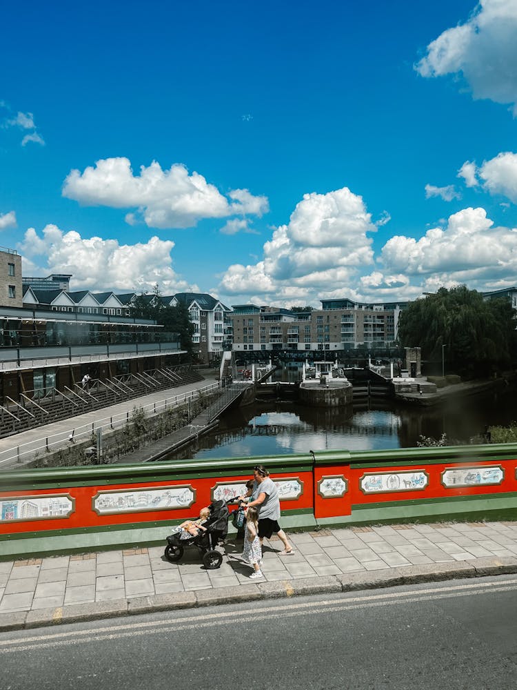 Family Taking A Walk On A Bridge