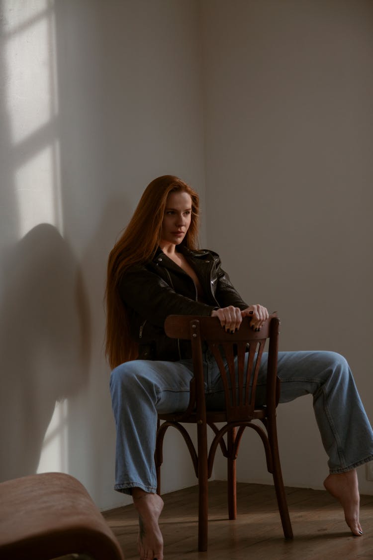 Woman Sitting On Chair And Posing