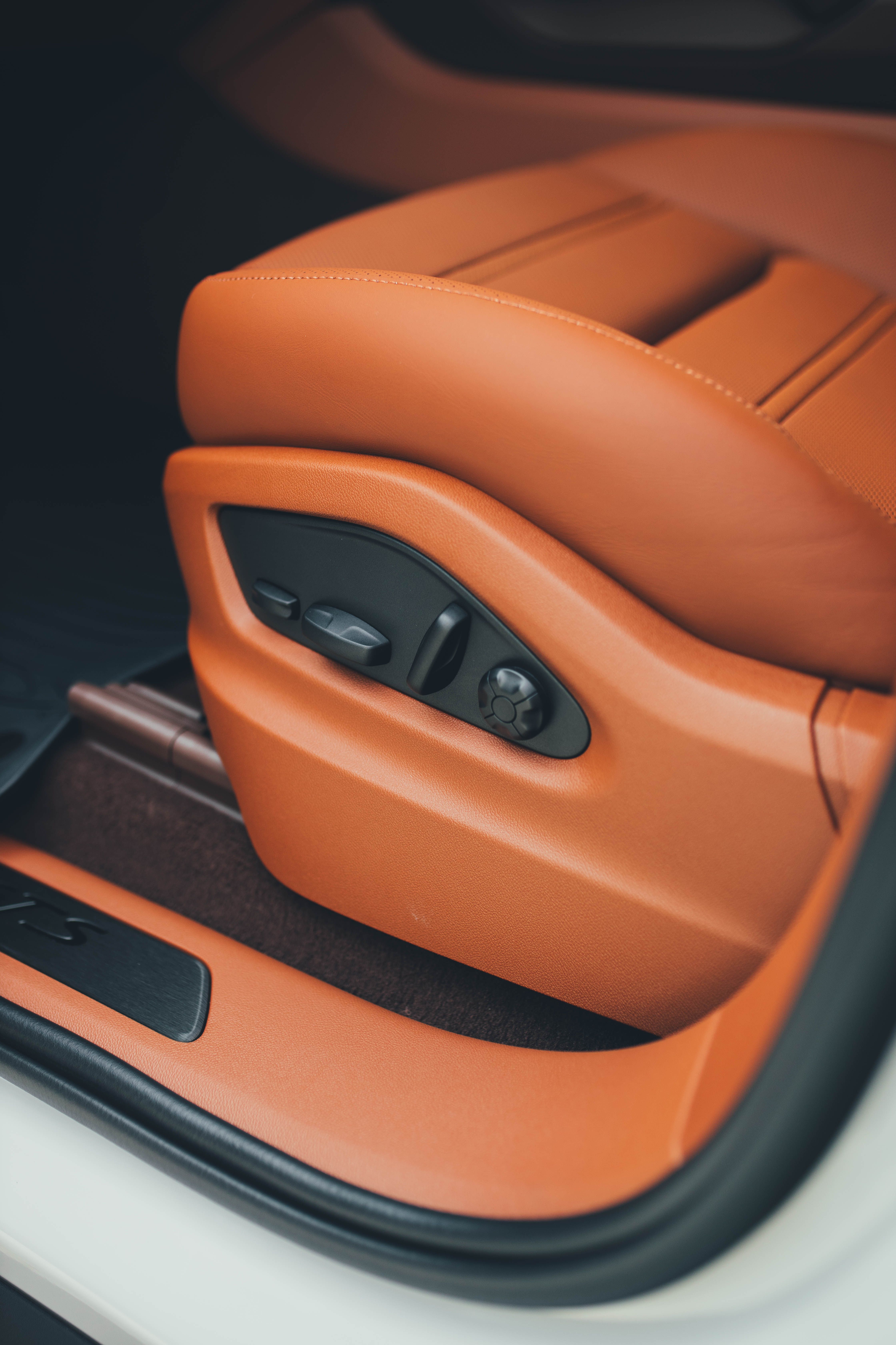 Free Detailed view of a luxurious automotive seat with elegant design. Stock Photo