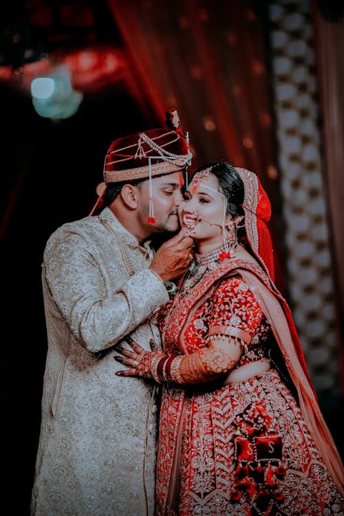 Kissing Newlyweds in Traditional Clothing