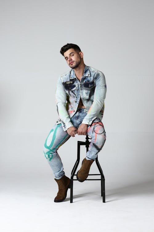 Young Man in a Denim Outfit Posing in Studio 