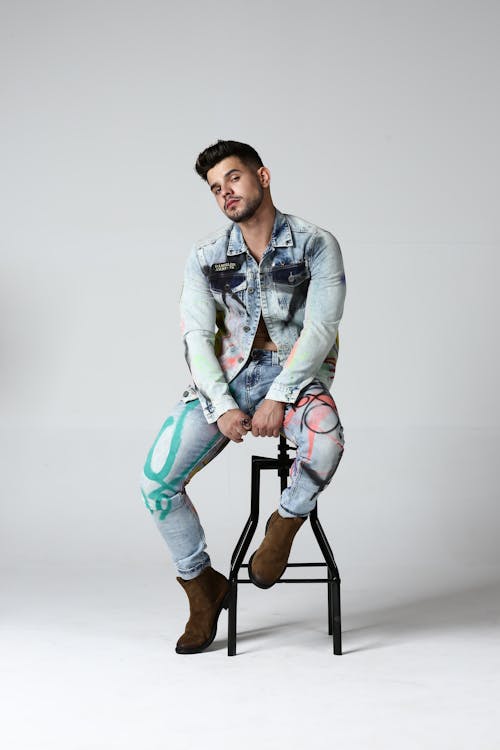 Free Young Man in a Denim Outfit Posing in Studio  Stock Photo