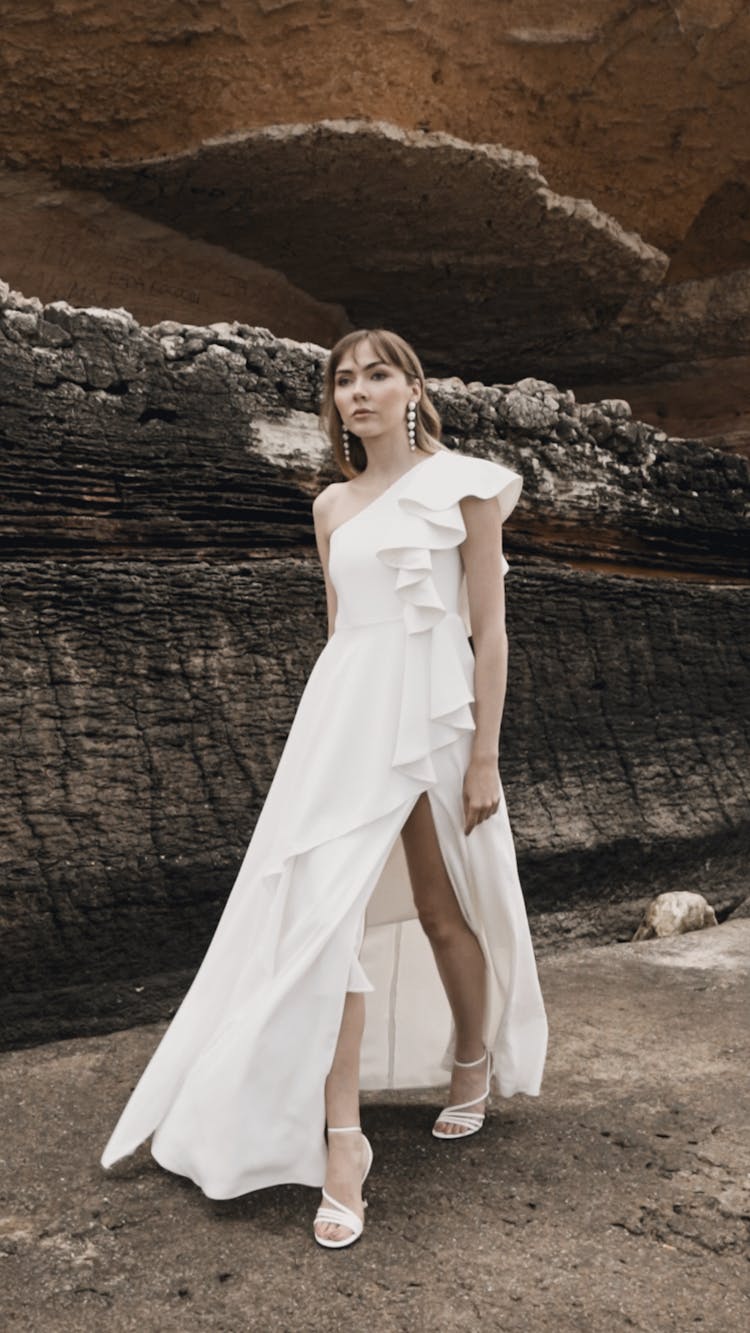 Model In A Long White Evening Dress In The Canyon