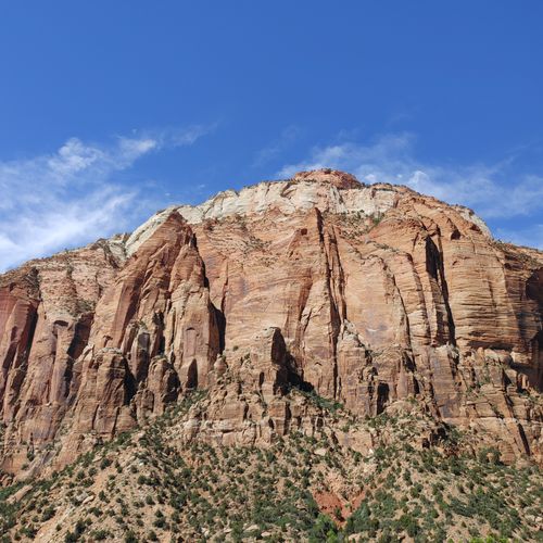 Free Stunning view of the red rock cliffs in Zion National Park under a clear blue sky. Stock Photo
