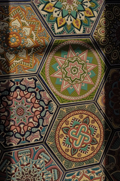Free Vibrant close-up of a detailed geometric mosaic with diverse colors and shapes. Stock Photo