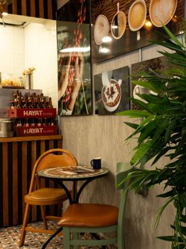 Warm and inviting café interior with coffee-themed decor and cozy seating area.