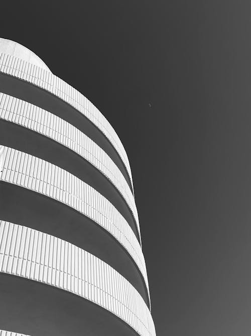 Building Wall and Clear Sky in Black and White