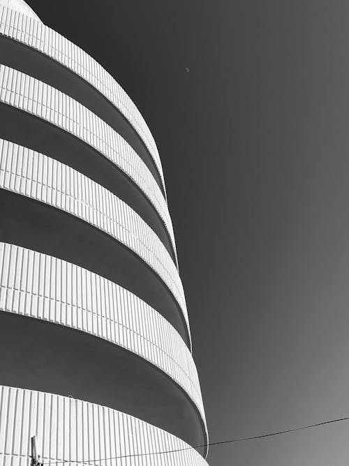 Clear Sky near Building Wall in Black and White