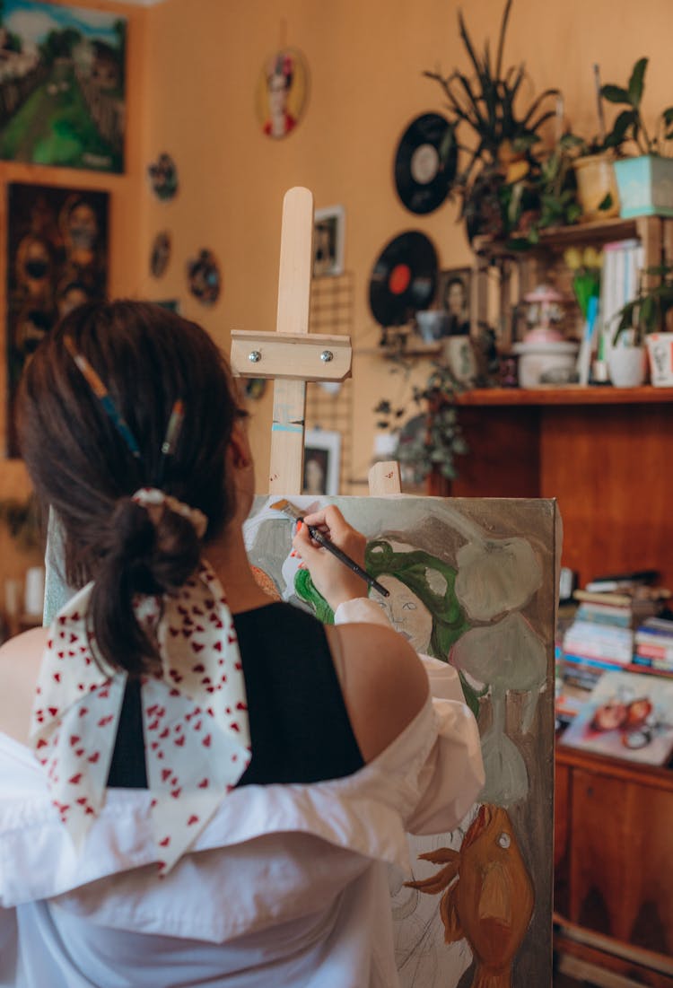 Back View Of Woman Painting