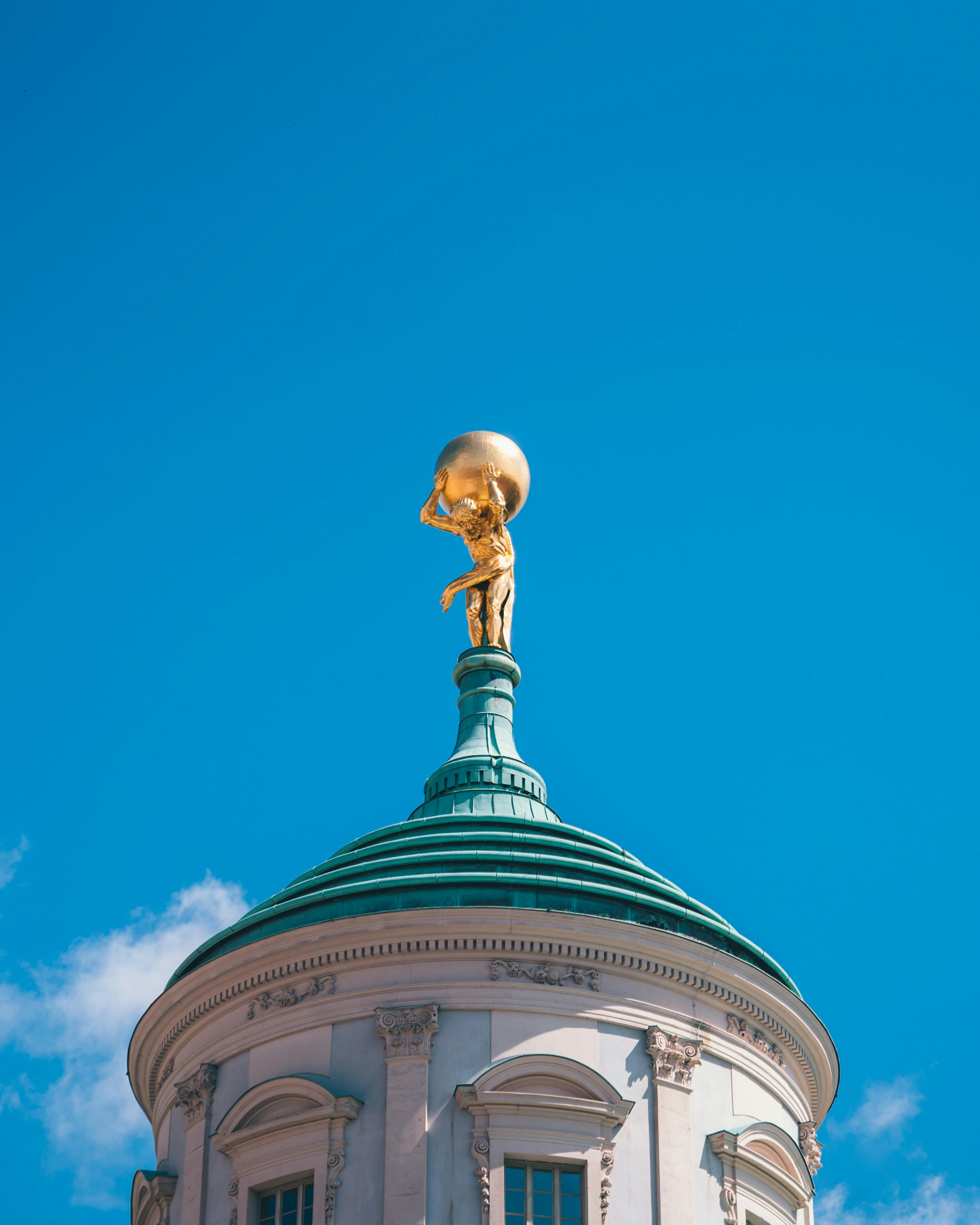 golden statue on a roof in new york