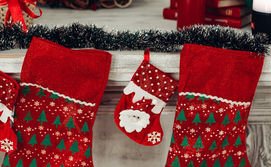 three red and green christmas stocking mounted on wall free stock