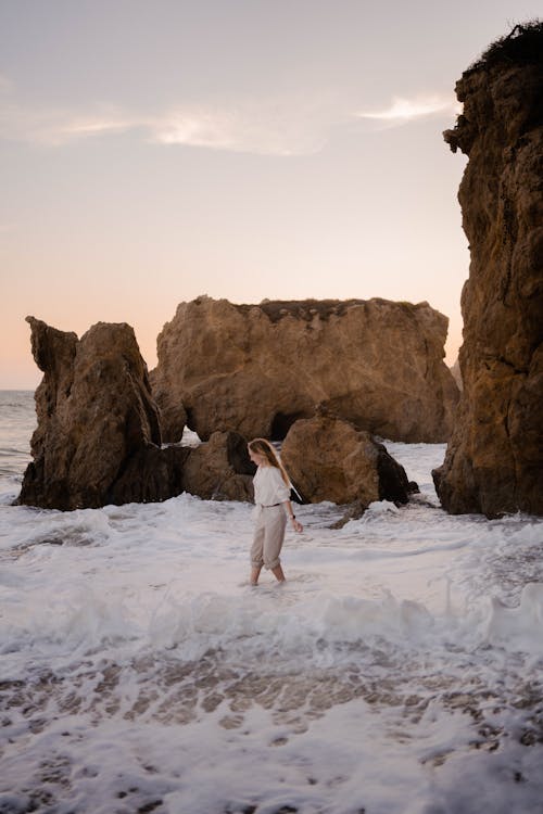 Woman Walking in Sea