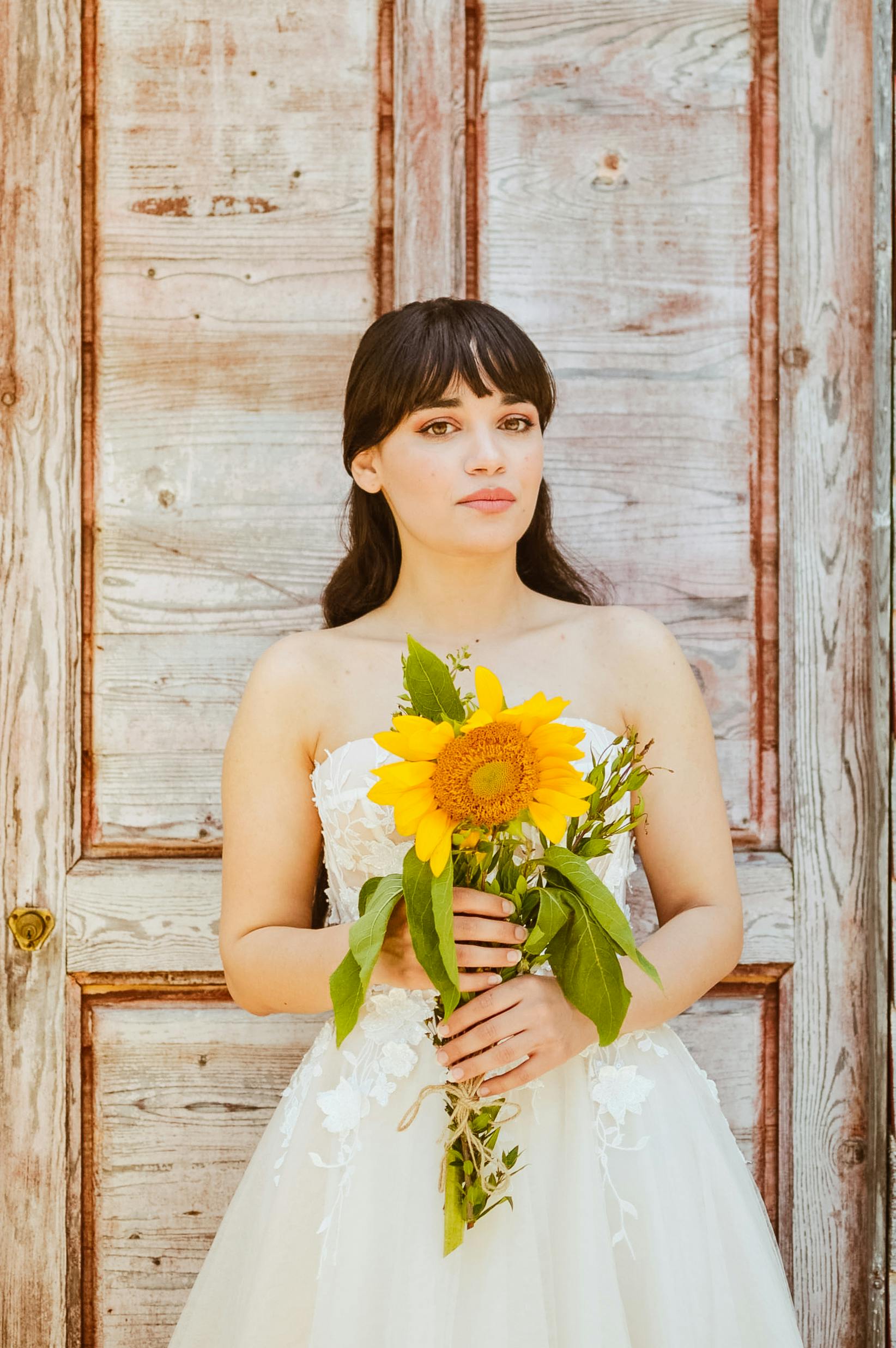 a bride with a sunflower