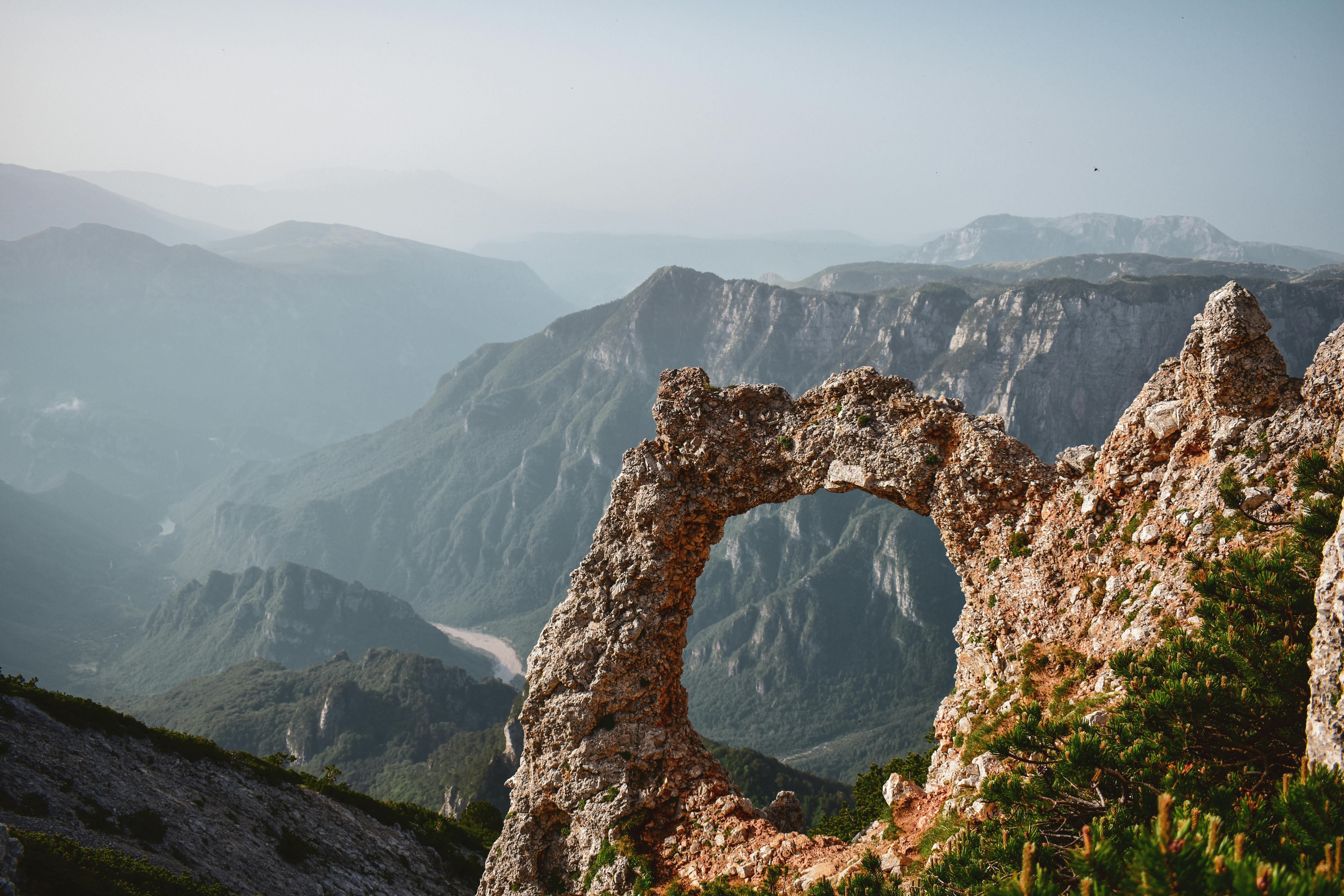 Breathtaking view of the natural arch on Cvrsnica Peak in Bosnia and Herzegovina, showcasing rugged mountain landscape.