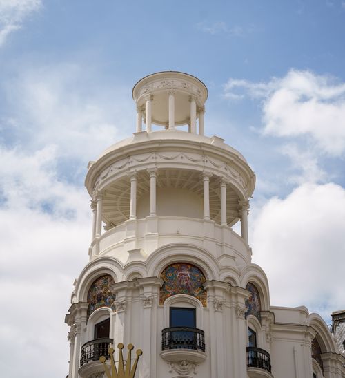 Free Elegant architectural detail of a historic building in Madrid, Spain under a clear blue sky. Stock Photo