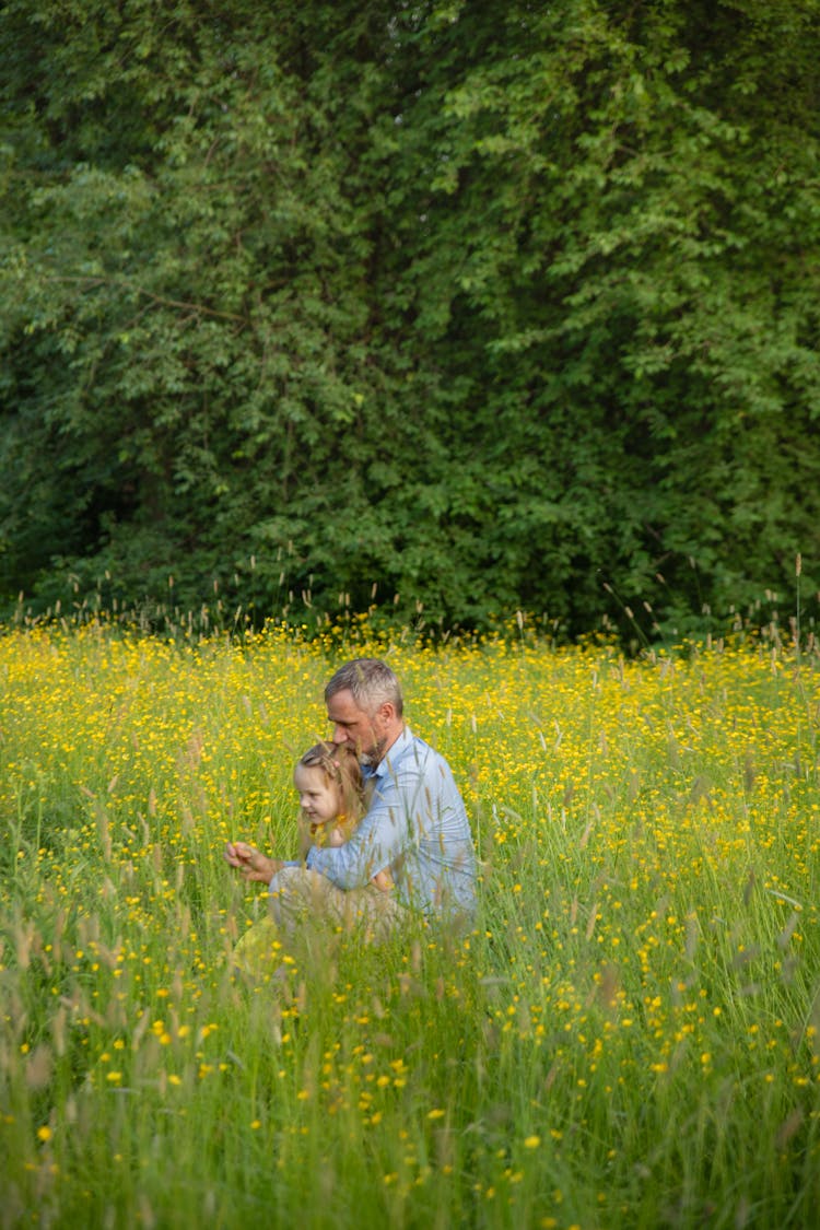 Man With His Daughter On A Meadow 