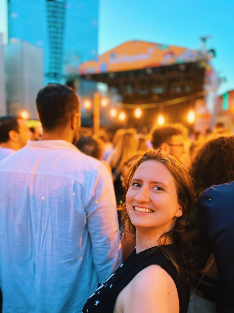 Woman Among People On Concert