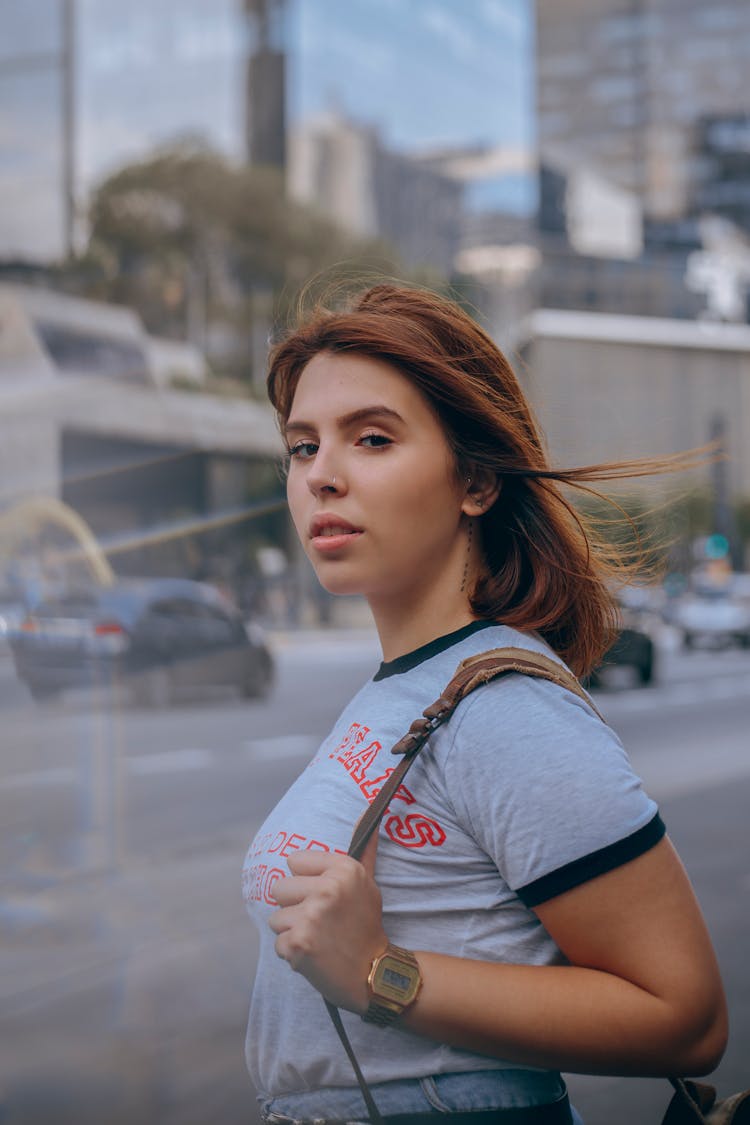 Photo Of Standing Woman Carrying Bag