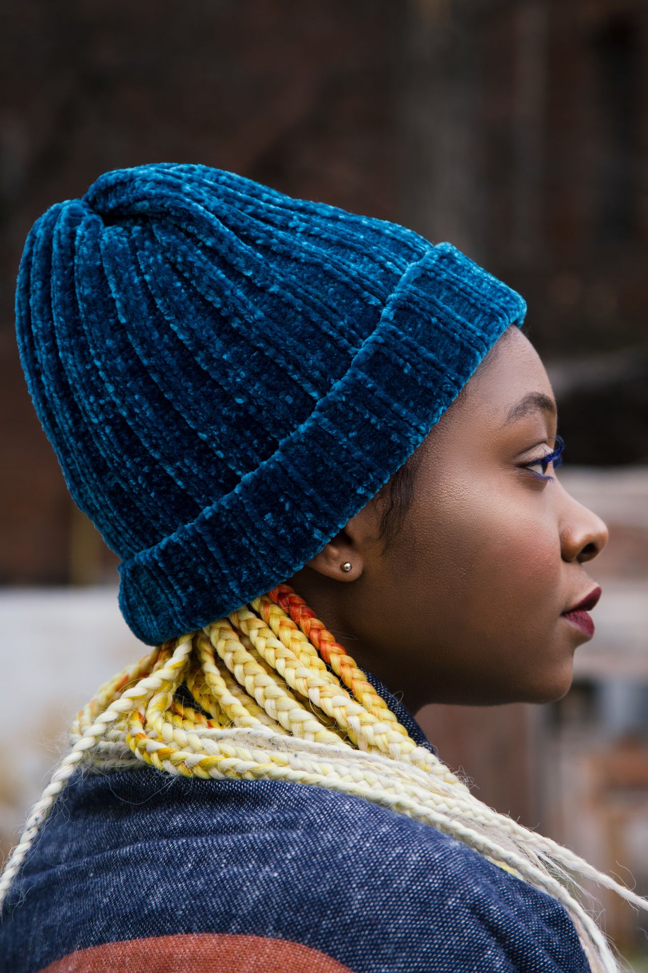 Woman wearing a teal knit cap