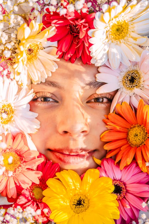 Colorful Flowers Petals around Woman Face