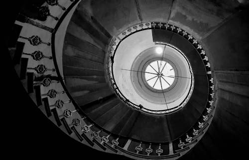 Low-Angle Photo of Spiral Stairs